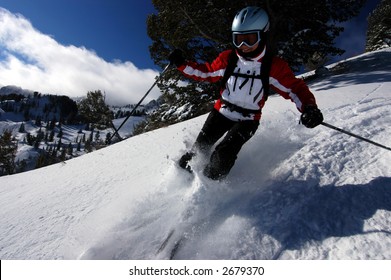 Woman Skiing Fresh Powder In A Utah Resort