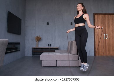 Woman Skipping With Jump Rope At Home.