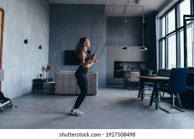 Woman Skipping With Jump Rope At Home.