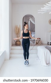 Woman Skipping With Jump Rope At Home.