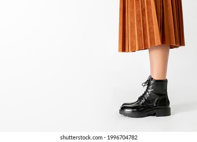 Woman In A Skirt Wearing Combat Boots 