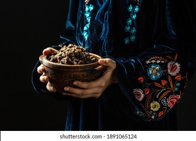 Woman In Slavic Dress Holding Bowl With Traditional Kutia, Eastern Orthodox Christians In Ukraine, Belarus And Russia During The Christmas Holiday. Closeup.