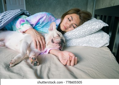 Woman sleep with dog , Nap with hugging dog in the loft bedroom at night, Warm hug to your pets. Stay with indoor dog. Close relationship between Dogs and dog owners. Watch over the house at night - Powered by Shutterstock