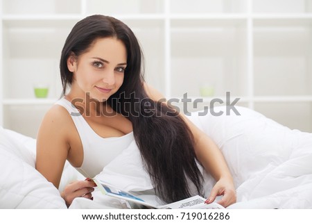 woman sleep and hold her head with subliminal stress or other possible symptoms