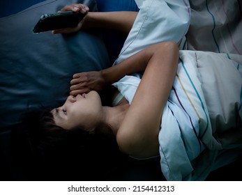 Woman Sleep And Holding Mobile On The Bed In Night At Room.couple Married Wait Husband Call Back.she Face Sad And Lonely. Card Poster For Broken Heart, Love Valentine Day, Break My Heart,pain Concept.