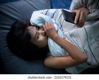 Woman Sleep And Holding Mobile On The Bed In Night At Room.couple Married Wait Husband Call Back.she Face Sad And Lonely. Card Poster For Broken Heart, Love Valentine Day, Break My Heart,pain Concept.