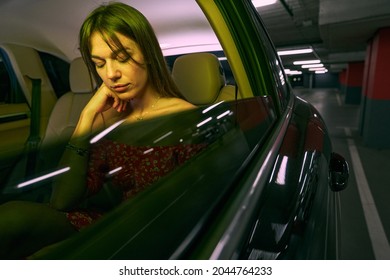 Woman Sleeping In Car During Night Trip