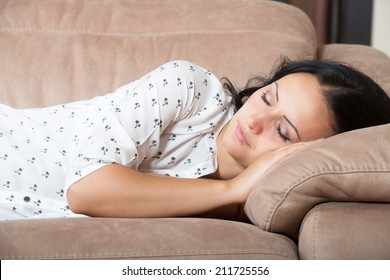 Woman Sleeping On The Couch