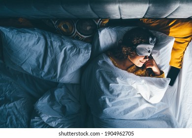 Woman Sleeping With A Sleep Mask On Her Eyes. 