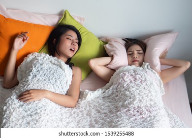 Woman Sleeping And Snoring Out Loud, Waking Her Roommate Up. Concept Of Sleeping Disorder, Snoring Problem