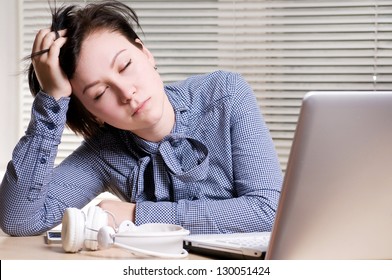 Woman sleeps on the workplace