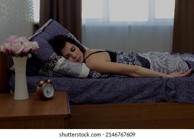Woman sleeps sound restful sleep bed in the morning.