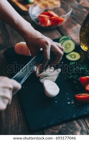 Similar – Image, Stock Photo Female hands making chicken skewers with vegetables for grilling