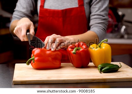 woman slicing fresh bell peppers