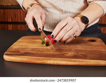 Woman Slicing Strawberries in Home Kitchen for Dessert Preparation. - Powered by Shutterstock