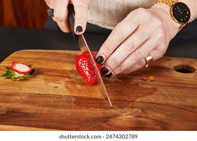 Woman Slicing Strawberries in Home Kitchen for Dessert Preparation. - Powered by Shutterstock