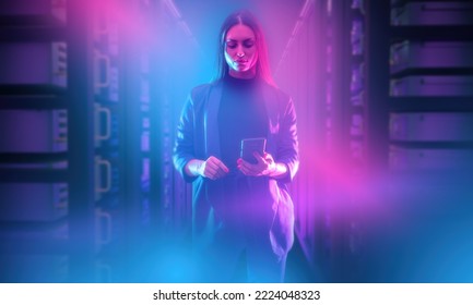 Woman with smart phone. Girl in data center. Businesswoman among server racks. IT manager in neon light. Server room high-tech companies. Woman manager in IT company. Data processing start-up manager - Powered by Shutterstock