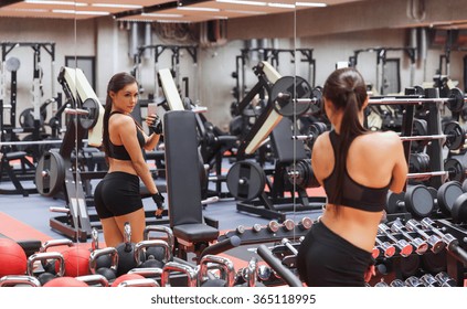 Woman With Smartphone Taking Mirror Selfie In Gym