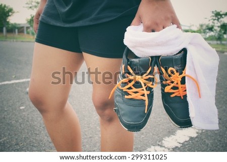Woman smartwatch with sports shoes