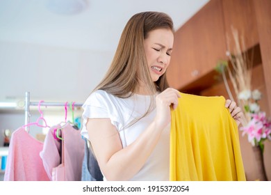 Woman Smelling Bad From Her Shirt Because Dirty Laundry, Smelly Stinky Musty From Clothes