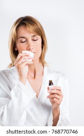 Woman Smelling A Handkerchief Soaked In Essential Oil