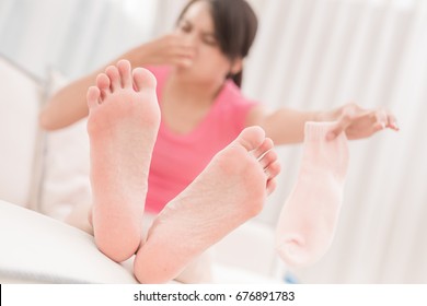 Woman With Smelly Socks In The Room