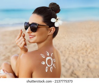 Woman smile applying sun cream  on face. Skin care. Body Sun protection. sunscreen. Female smear moisturizing lotion on skin.Skin Protection 