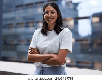 Woman, smile and outside on balcony with arms crossed for happiness in portrait with pride for company. Glasses, designer and employee with outdoor office for relax on break in urban town in New York