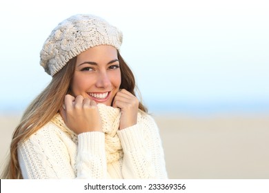 Woman Smile With A Perfect White Teeth In Winter With The Beach In The Background