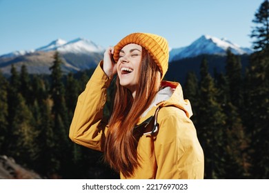 Woman Smile With Teeth Hiker Portrait In Yellow Raincoat Travel In The Fall And Hiking In The Mountains In The Sunset Sunshine Freedom