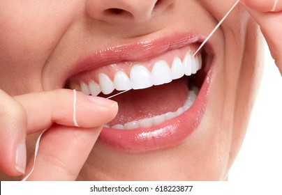 Woman Smile With Tooth Floss