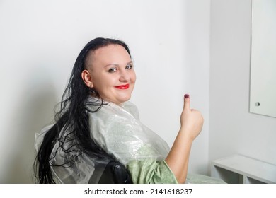 Woman Smiling With Half Shaved Head In Barber Chair Showing Class. Horizontal Photo