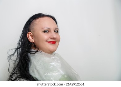 Woman Smiling With Half Shaved Head In Barber Chair. Horizontal Photo