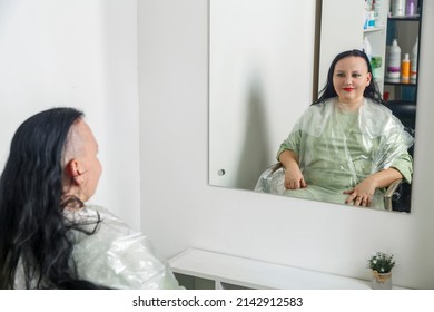 Woman Smiling With Half Shaved Head In Barber Chair Reflected In Mirror. Horizontal Photo