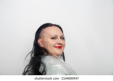 Woman Smiling With Half Shaved Head In Barber Chair. Horizontal Photo