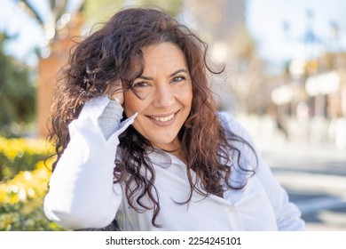Woman Smiling. Happy Woman Enjoying A Spring Day In A City Park. - Shutterstock ID 2254245101
