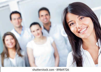 Woman Smiling At The Hospital With Medical Staff