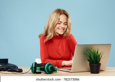  Woman Smiling Looking Into Laptop, Headphones, Playstation                              