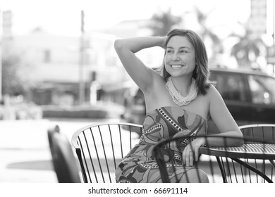 Woman Smiling At A Road Side Diner Table