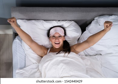 Woman Smiling While Waking Up From Bed