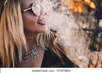 Woman Smoking Cannabis on a Beautiful Fall Day