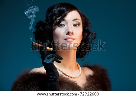 Woman smoking cigar with retro style look