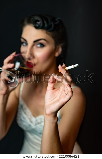 woman smoking\
cigarette vintage slip\
lingerie\
