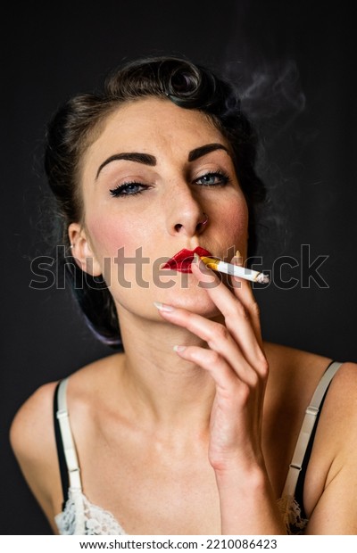 woman smoking\
cigarette vintage slip\
lingerie\
