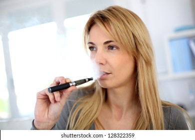 Woman smoking with electronic cigarette