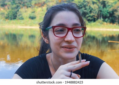 Woman Smoking Marijuana By The Lake