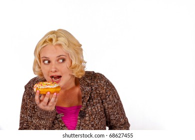 A woman sneaks a doughnut