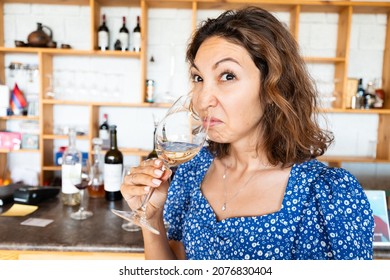Woman Sniffs And Tasting Bad Wine. The Concept Of Loss Of Sense Of Smell And Long Covid