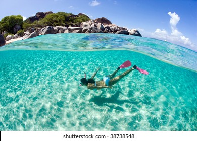 Woman Snorkeling Underwater In Caribbean Islands