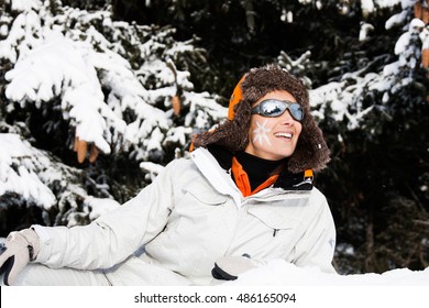 Woman In The Snow With A Small Sun Drawing On The Cheek